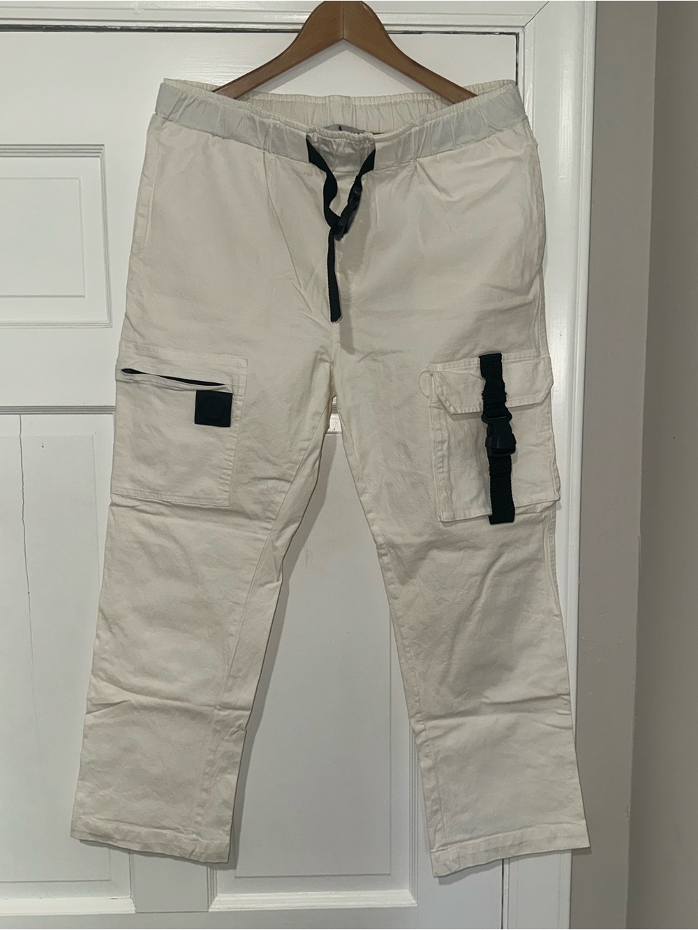 All Tribe Clothing brand Men’s white/cream cargo pants.
